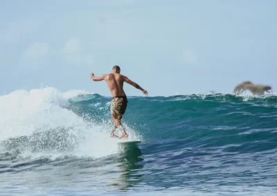 How does longboarding differ from other types of surfing